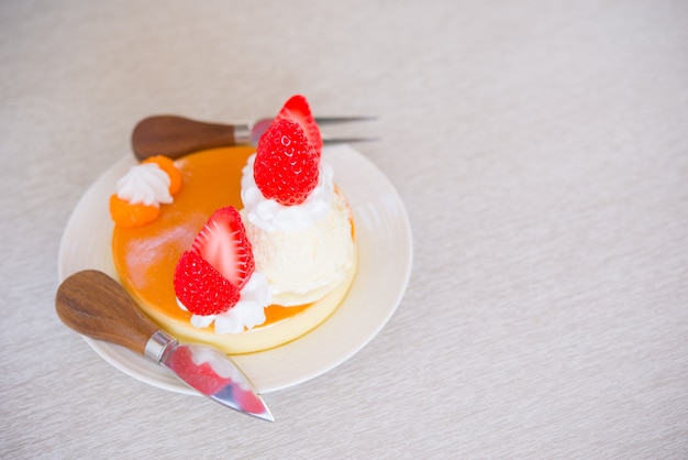 Delicious pancakes with strawberry on table background.