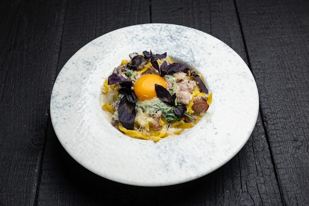 delicious pasta on a dark table in a restaurant