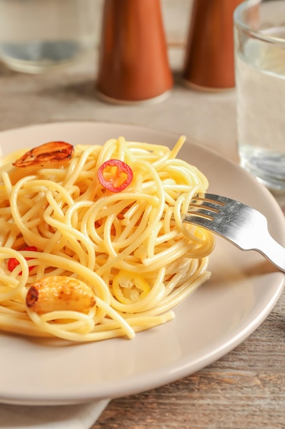 Delicious pasta with garlic and chili pepper on plate