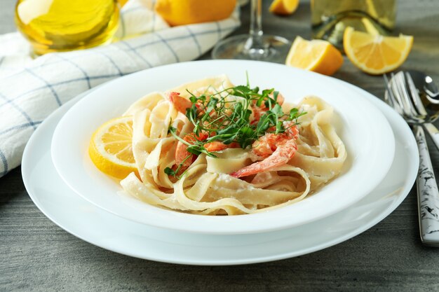 Delicious pasta with tasty shrimps, close up