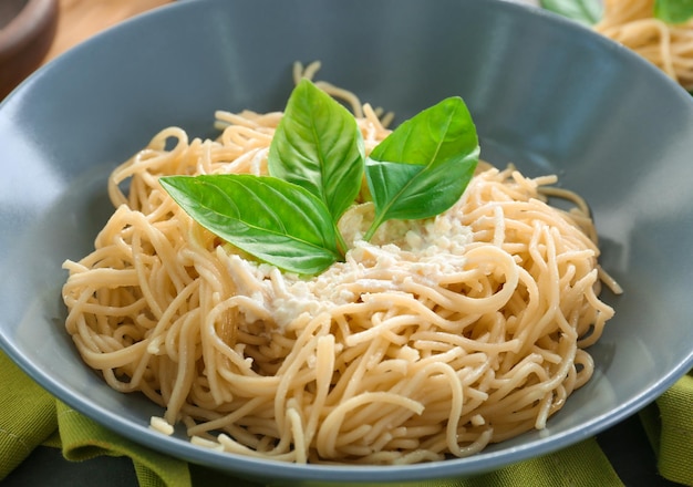 Delicious pasta with white sauce in plate