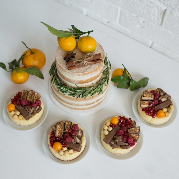 Delicious pastries decorated with tangerines and chocolate