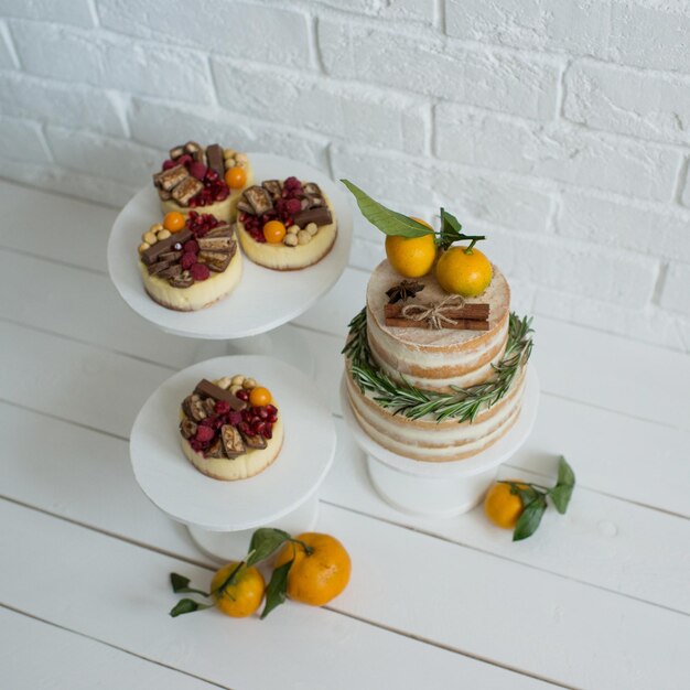 Delicious pastries decorated with tangerines and chocolate