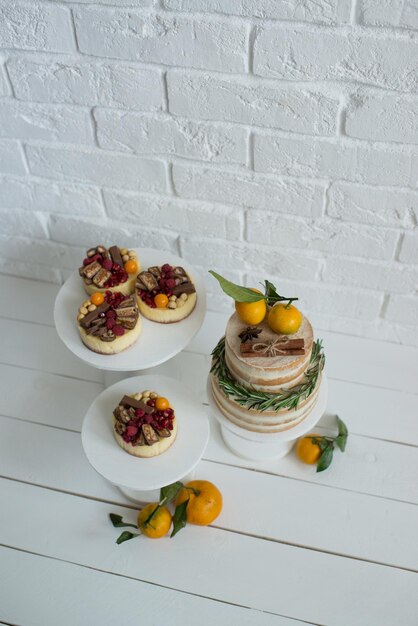 Delicious pastries decorated with tangerines and chocolate