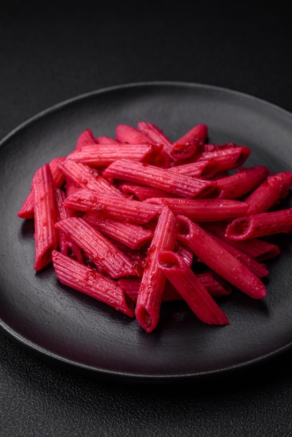 Delicious penne pasta with beets cheese salt and spices