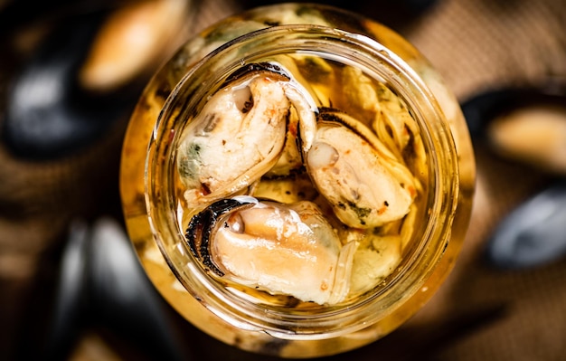 Delicious pickled mussels in a glass jar