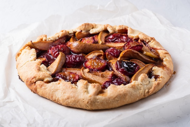 Delicious pie with plums and pears