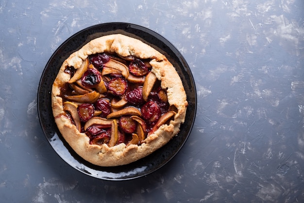 Delicious pie with plums and pears