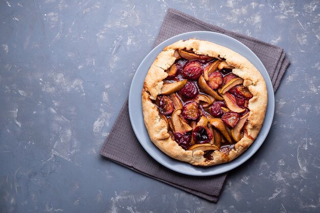 Delicious pie with plums and pears