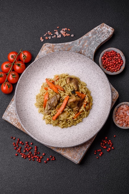 Delicious pilaf with vegetables salt spices and herbs in a ceramic plate