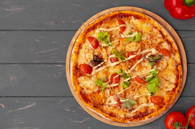 delicious pizza on gray wooden