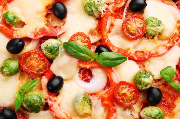 Delicious pizza with cheese and vegetables closeup