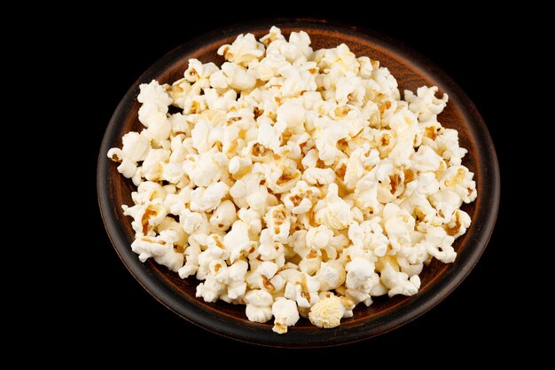 Delicious popcorn corn snack in a plate close-up