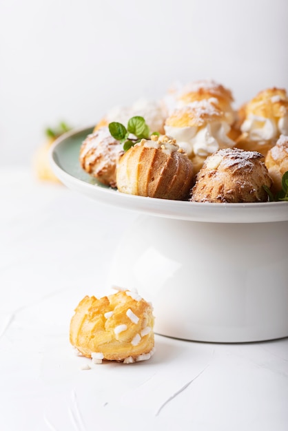 Delicious profiteroles with cream