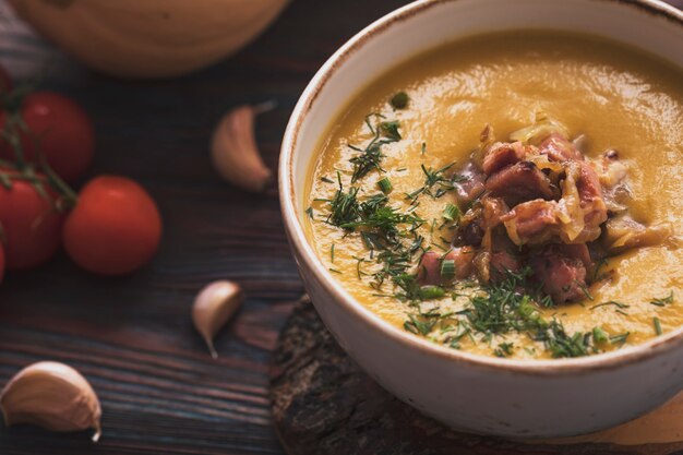 Delicious pumpkin soup with fried bacon.