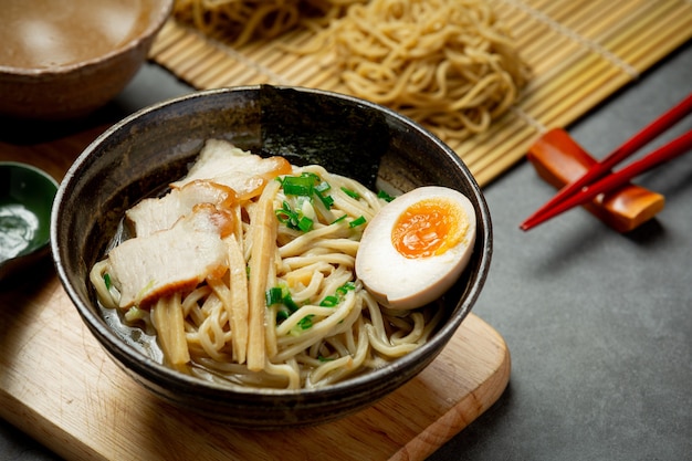 Delicious ramen on dark surface