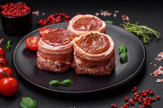 Delicious raw fresh pork or chicken meat rolls wrapped in bacon