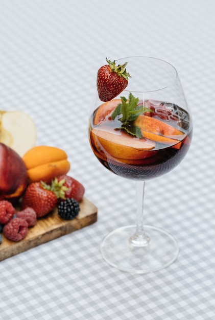 Delicious Red Sangria with fruits on table