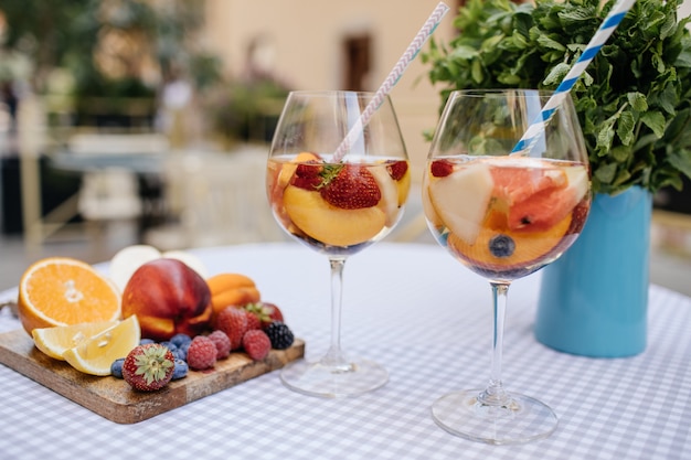 Delicious Red Sangria with fruits on table