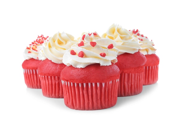Delicious red velvet cupcakes on white background