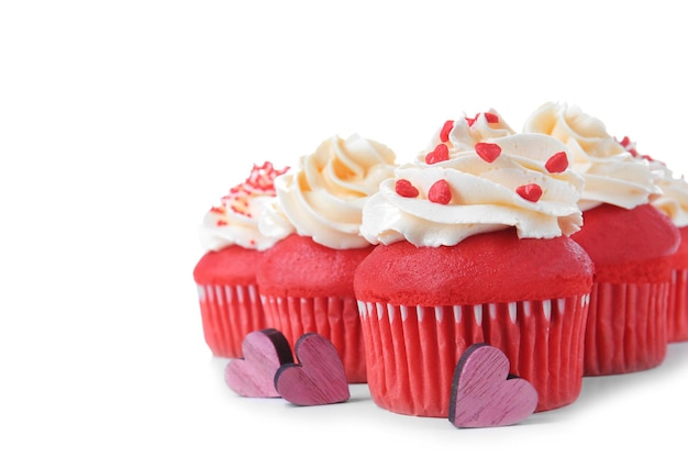 Delicious red velvet cupcakes on white background