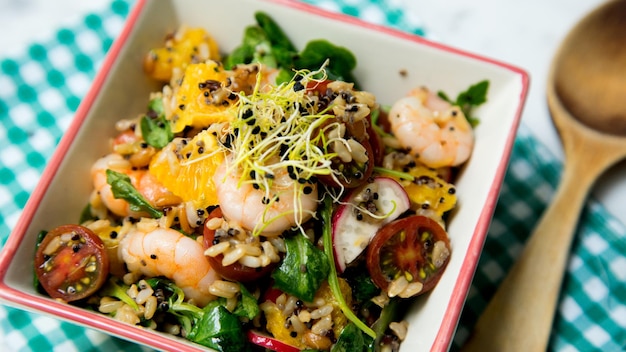 Delicious rice salad with prawns and spinach