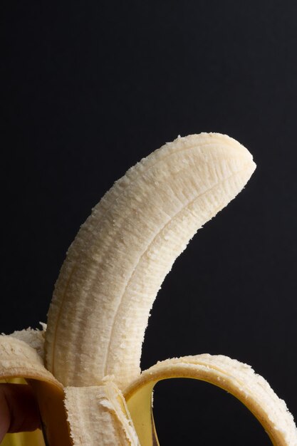 Photo delicious ripe banana isolated on black background