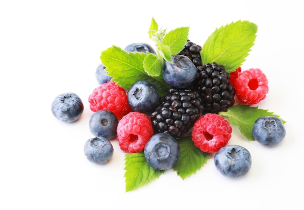 Delicious ripe berries on white background