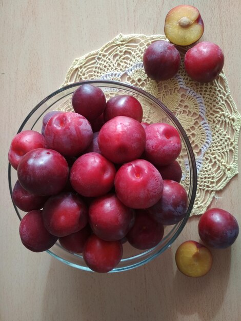 delicious ripe juicy red plums on the table