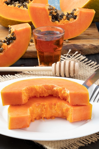 Delicious ripe papaya with honey.