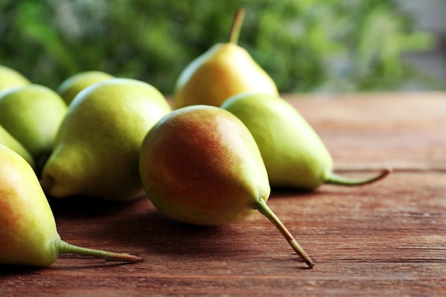 Delicious ripe pears on table