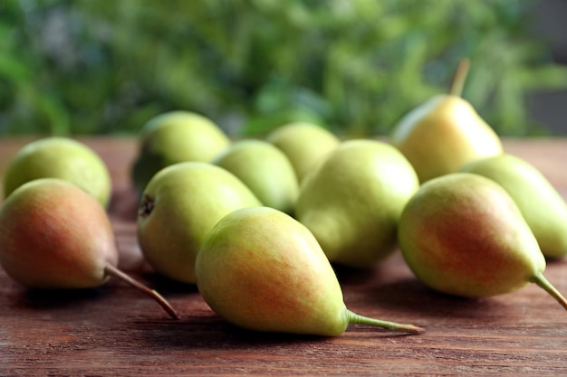 Delicious ripe pears on table