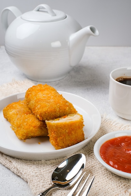 Delicious Risoles or Risol Mayo is a typical Indonesian traditional street food made from flour skin, meat and vegetables stuffing inside with mayonnaise and chili sauce.