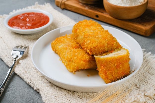 Delicious Risoles or Risol Mayo is a typical Indonesian traditional street food made from flour skin, meat and vegetables stuffing inside with mayonnaise and chili sauce.