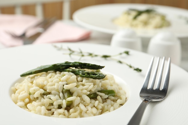delicious risotto with asparagus in plate closeup