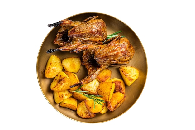 Delicious roasted quails with herbs in a plate with fried potato Isolated on white background