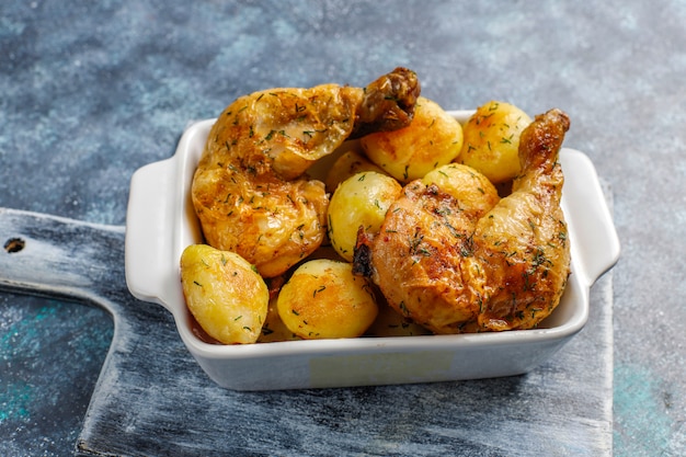 Delicious roasted young potatoes with dill and chicken,top view