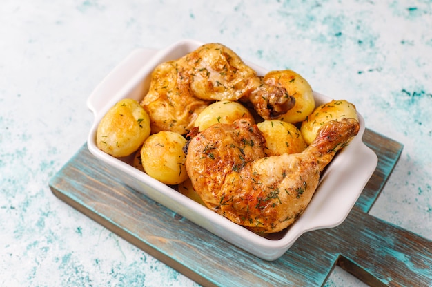 Delicious roasted young potatoes with dill and chicken,top view