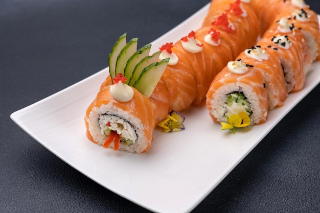 Delicious rolls on a dark background Japanese cuisine Close up