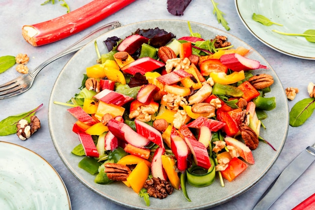 Delicious salad with rhubarb herbs and nuts