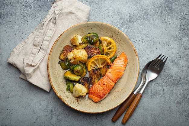 Delicious salmon fillet with grilled brussels sprouts on