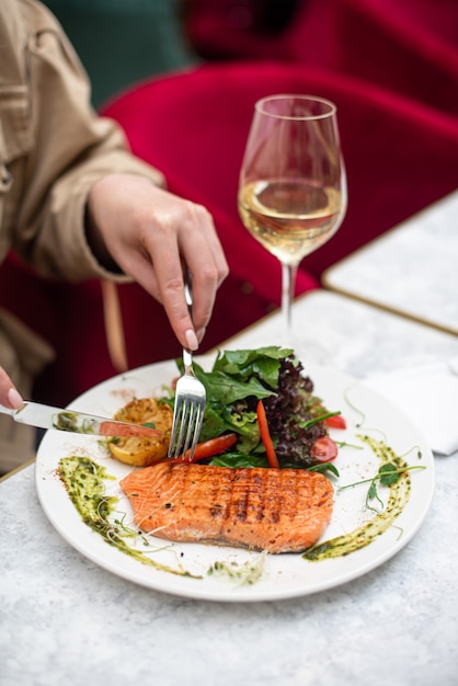 Delicious salmon in restaurant on a wooden table