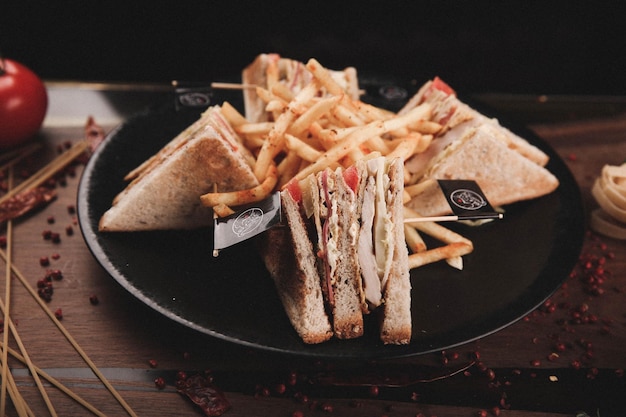 Delicious sandwich with french fries, breakfast meal.