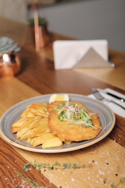 Delicious schnitzel served with french fries 