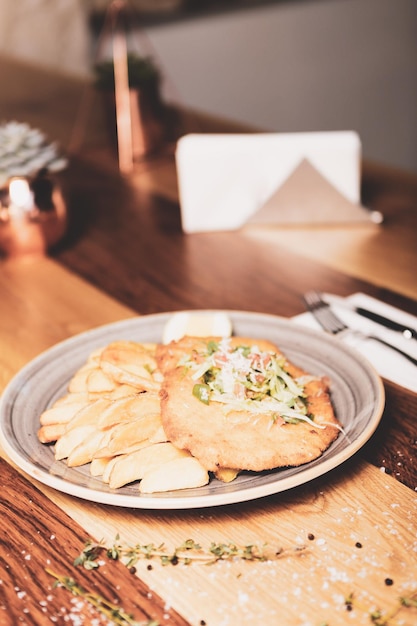 Delicious schnitzel served with french fries