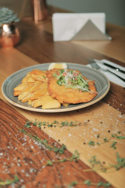 Delicious schnitzel served with french fries