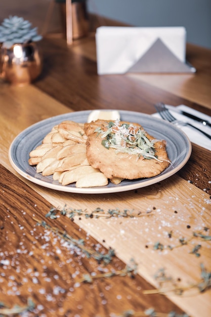 Delicious schnitzel served with french fries