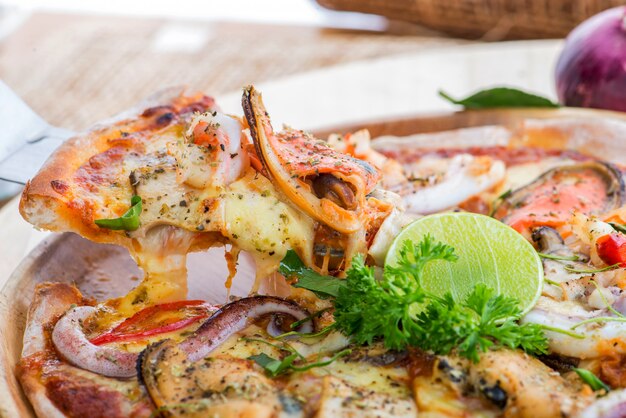 Delicious Seafood Pizza on a wooden table