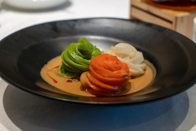 Delicious sesame paste mixed with colored dough on the plate