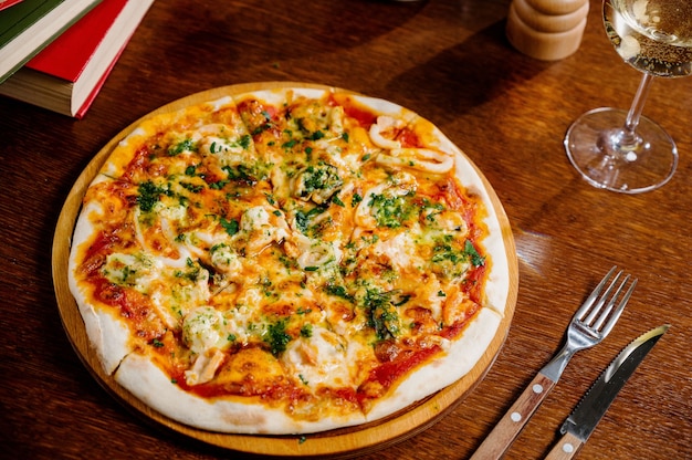 Delicious Shrimp pizza on wood table